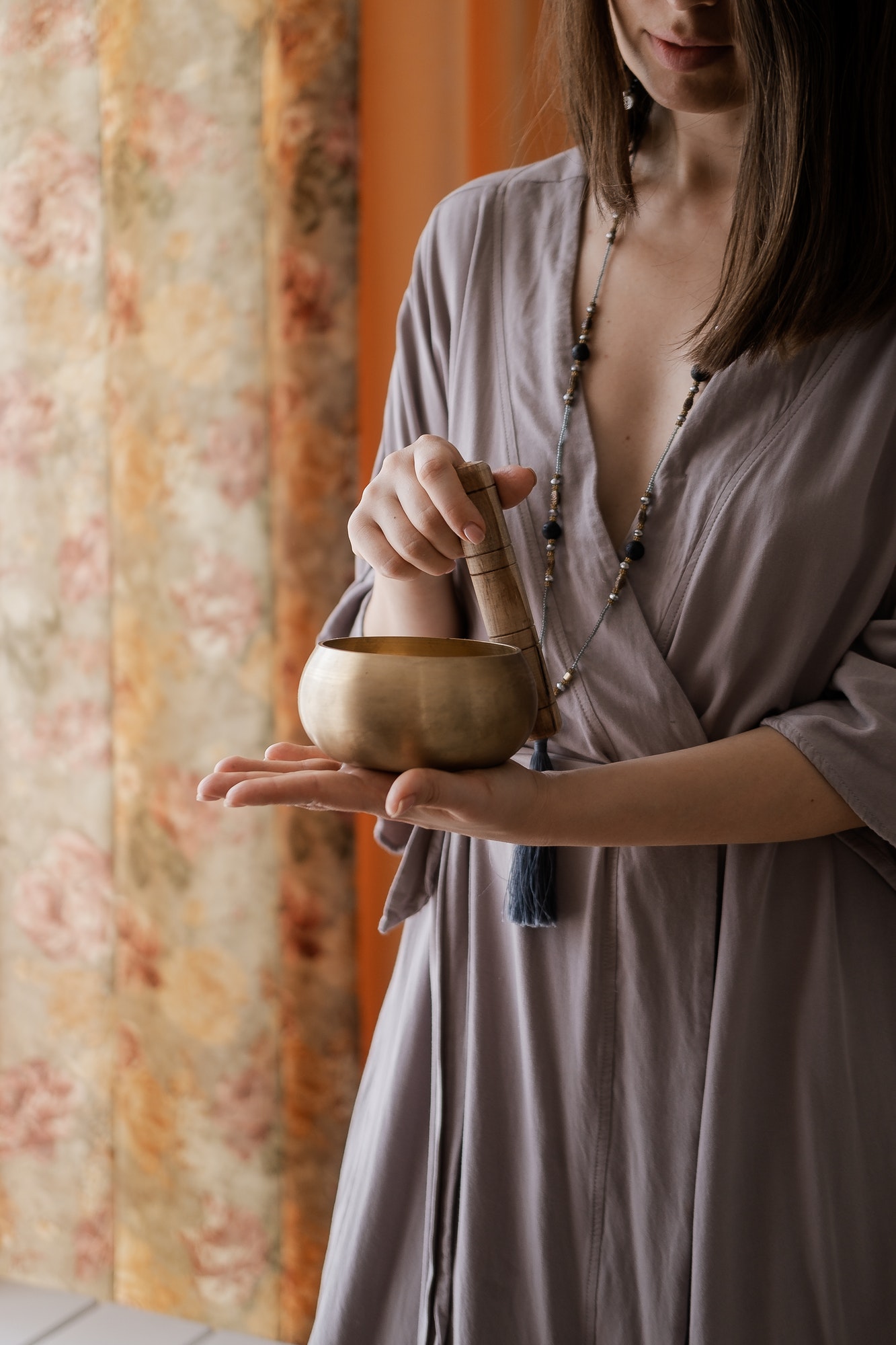 Woman holding in hands singing bowl